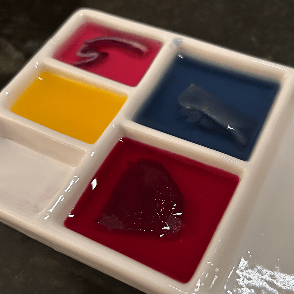 Above: A palette with natural dye including yellow made from tumeric, light pink made from red cabbage, blue made from red cabbage and baking soda, and red made from beet root.